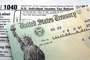 Should you save or invest your tax refund - image