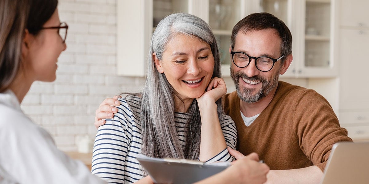 Couple meeting investment adviser